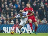 Jordan Henderson and Victor Anichebe in action during the Premier League game between Liverpool and Sunderland on November 26, 2016