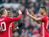 Manchester United forward Marcus Rashford celebrates with Wayne Rooney and Anthony Martial after scoring during the FA Cup third round clash with Reading at Old Trafford on January 7, 2017