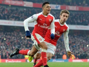 Alexis Sanchez celebrates scoring the winner during the Premier League game between Arsenal and Burnley on January 22, 2017