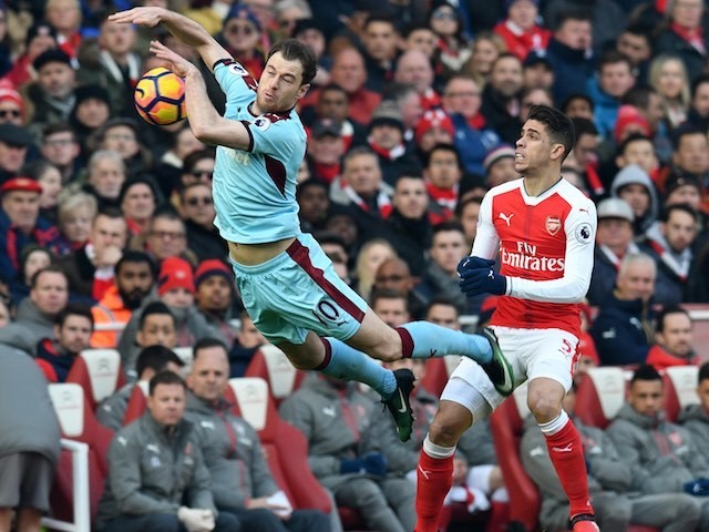 Gabriel Paulista and Ashley Barnes in action during the Premier League game between Arsenal and Burnley on January 22, 2017