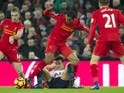 Joel Matip and Dele Alli in action during the Premier League game between Liverpool and Tottenham Hotspur on February 11, 2017