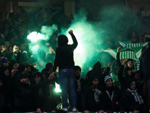 Saint-Etienne fans let off flares during the Europa League clash with Manchester United at Old Trafford on February 16, 2017