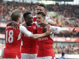 Arsenal midfielder Granit Xhaka celebrates with teammates after opening the scoring during his side's Premier League clash with Manchester United at the Emirates Stadium on May 7, 2017