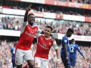 Arsenal striker Danny Welbeck celebrates with Alexis Sanchez after scoring during his side's Premier League clash with Manchester United at the Emirates Stadium on May 7, 2017