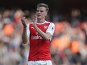 Rob Holding applauds during the Premier League game between Arsenal and Manchester United on May 7, 2017