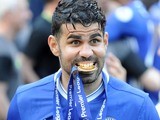 Diego Costa eats his medal during the Premier League game between Chelsea and Sunderland on May 21, 2017