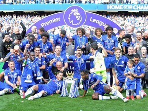 The Chelsea squad celebrate with the trophy during the Premier League game between Chelsea and Sunderland on May 21, 2017