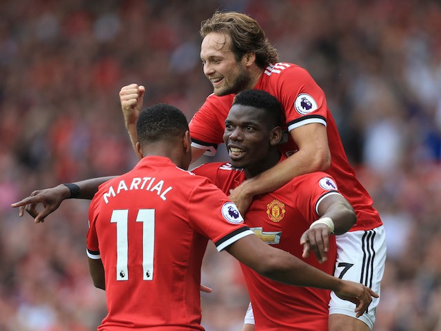 Paul Pogba celebrates with Anthony Martial and Daley Blind after scoring during the Premier League game between Manchester United and West Ham United on August 13, 2017