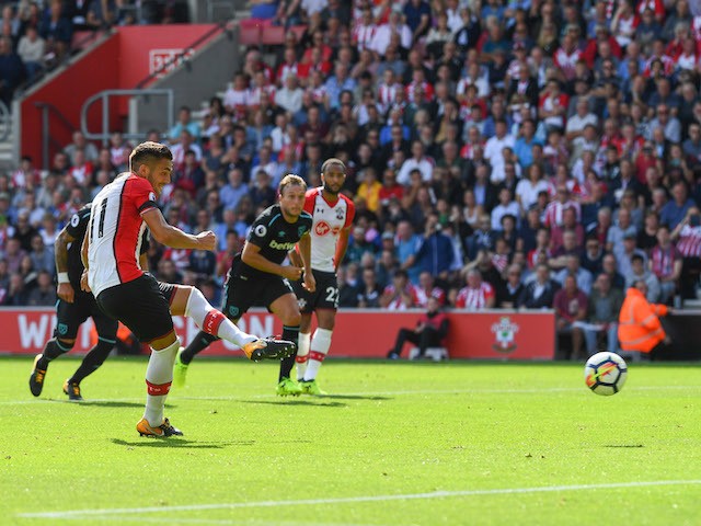 Dusan Tadic scores from the spot during the Premier League game between Southampton and West Ham United on August 19, 2017