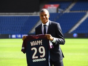 Kylian Mbappe poses with a Paris Saint-Germain shirt following his move from AS Monaco