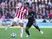 Eric Maxim Choupo-Moting and Antonio Valencia in action during the Premier League game between Stoke City and Manchester United on September 9, 2017
