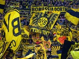 Dortmund's fans cheer their team during the German First division Bundesliga football match Borussia Dortmund vs Hannover 96 on October 25, 2014