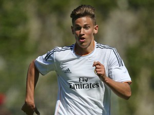 Marcos Llorente of Real Madrid runs with the ball during the UEFA Youth League Semi Final match between Real Madrid and Benfica Lisbon at Colovray Stadion on April 11, 2014 in Nyon, Switzerland.